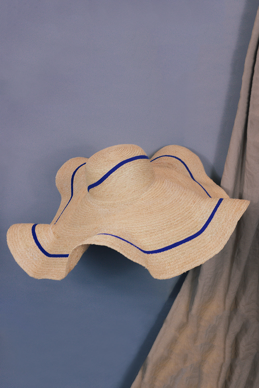 Wide brim raffia hat with curved brim from Formscape