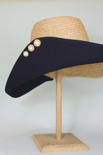 Load image into Gallery viewer, Handmade raffia buttons on Romy wide brim hat from natural raffia and black cotton canvas