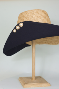 Handmade raffia buttons on Romy wide brim hat from natural raffia and black cotton canvas