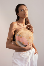 Load image into Gallery viewer, Clementine is round in shape. The two sides of the bag are decorated, incorporating details to emphasize a fun garden