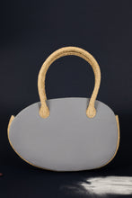 Load image into Gallery viewer, Lalaland handbags have the shape of an egg, thanks to the craftsmanship, layered decoration and the harmony of dreamy colors that we can associate with many objects.