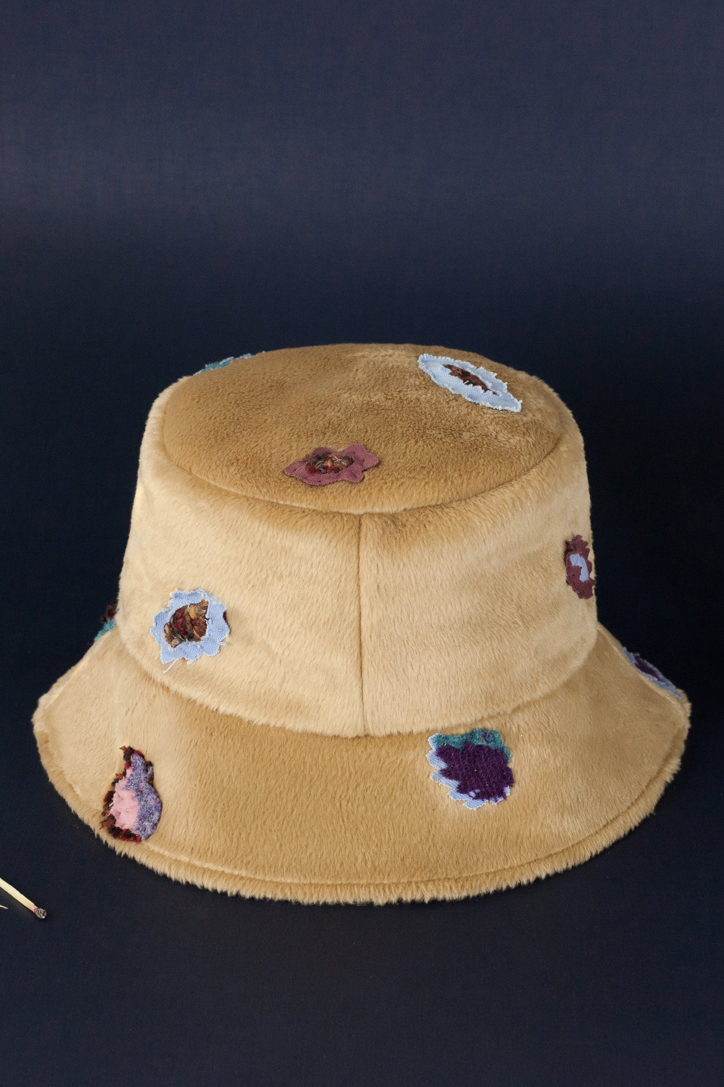Bucket hat made from eco fur with colorful leopard pieces