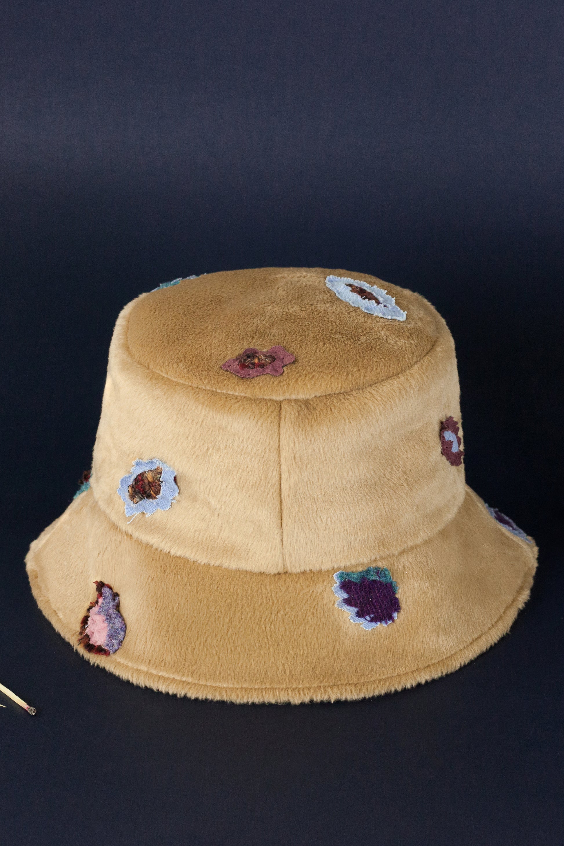 Bucket hat made from eco fur with colorful leopard pieces