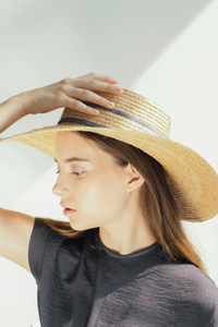 Model wearing Merlier Coast Classic raffia straw wide brim hat