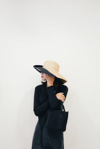 Romy wide brim hat from natural raffia and black cotton canvas