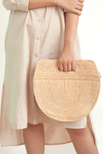 Load image into Gallery viewer, Marjolie baWhen you look at marjorlie you can think of pictures of faces. The curve of the bag is sewn smooth. The outer surface is natural raffia knit creating a balance between color and shape. Thick lining.g, Formscape, Raffia, soft moon light, Eco luxury